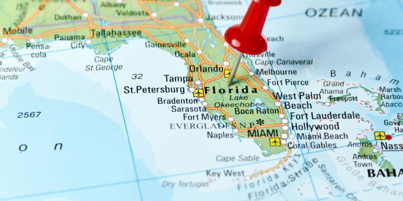 A map has a pin that points to Florida.