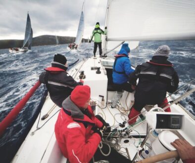 A group of friends are sailing on a boat.