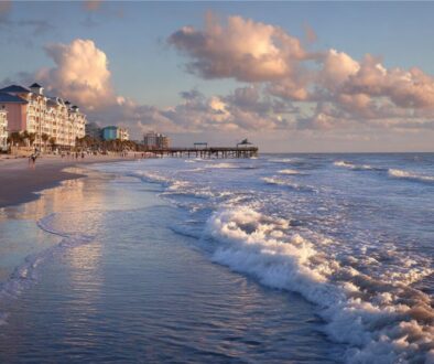 Beautiful sunset over the pier and beachfront hotels in Cocoa Beach