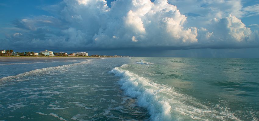 Dramatic ocean view with waves and storm clouds over Cocoa Beach Florida