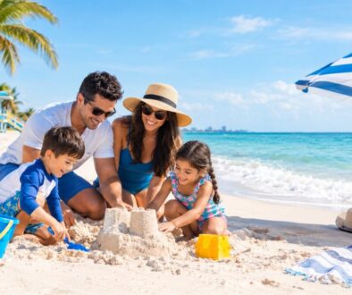 Family building a sandcastle together on one of the best family beaches in Florida.